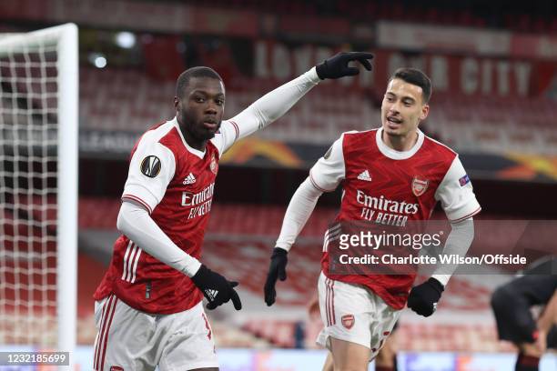 Nicolas Pepe of Arsenal celebrates with Gabriel Martinelli of Arsenal after scoring their 1st goal during the UEFA Europa League Quarter Final First...