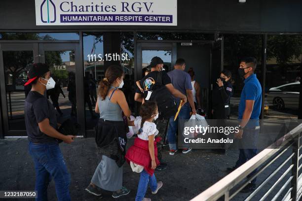 Group of migrants are seen as they were taken to shelters by US officials after the registration process and COVID-19 tests in McAllen, Texas, United...