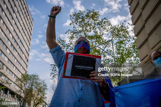 Protester holds up his fist during the demonstration. As part of the International Day of the Gypsy People, the Gypsy community in Madrid demonstrate...