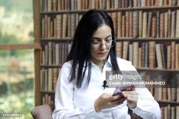 Rawan Salim, an 18-year-old activist, poses for a picture during an interview in the northeastern city of Sulaymaniyah in Iraq's autonomous Kurdistan...