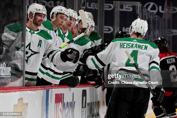 Miro Heiskanen of the Dallas Stars celebrates with teammates after scoring a goal in the second period against the Chicago Blackhawks at the United...