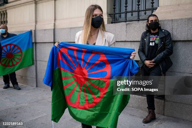 Woman holds a gypsy flag during the demonstration. As part of the International Day of the Gypsy People, the Gypsy community in Madrid demonstrate on...