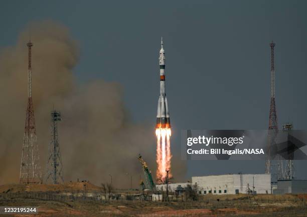 In this handout image provided by NASA, the Soyuz MS-18 rocket launches at the Baikonur Cosmodrome on April 9, 2021 in Baikonur, Kazakhstan. The...