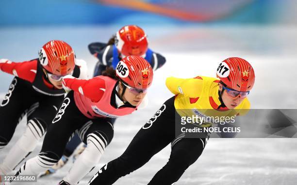 Players compete during a short track speed skating test event for the 2022 Beijing Winter Olympic Games at the Capital Indoor Stadium in Beijing on...