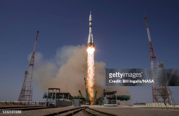 In this handout image provided by NASA, The Soyuz MS-18 rocket is launched with Expedition 65 NASA astronaut Mark Vande Hei, Roscosmos cosmonauts...