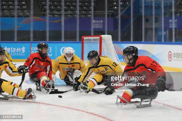 Chinese players compete during the Para Ice Hockey test event for the Beijing 2022 Winter Olympics at National Indoor Stadium on April 9, 2021 in...