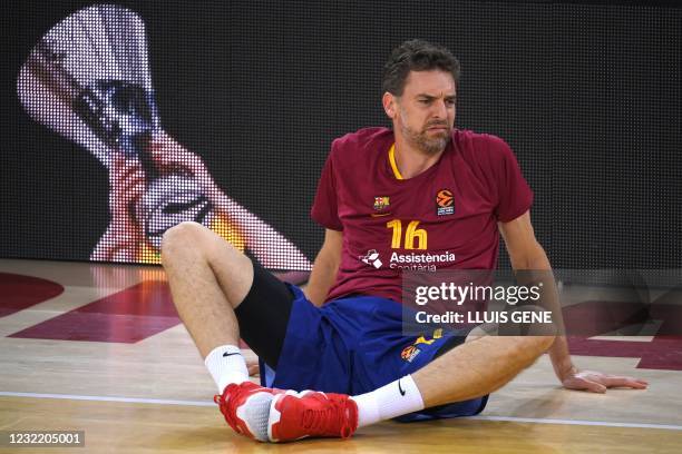 Barcelona's Spanish center Pau Gasol stretches during the warming-up before the Euroleague basketball match between Barcelona and Bayern Munich at...