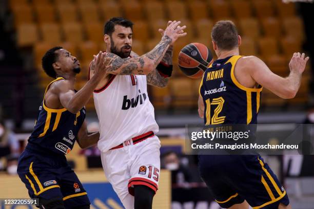 Georgios Printezis, #15 of Olympiacos Piraeus competes with Errick McCollum, #3 of Khimki Moscow Region during the 2020/2021 Turkish Airlines...