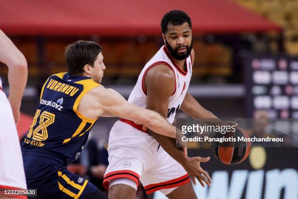 Aaron Harrison, #2 of Olympiacos Piraeus competes with Evgeny Voronov, #18 of Khimki Moscow Region during the 2020/2021 Turkish Airlines EuroLeague...