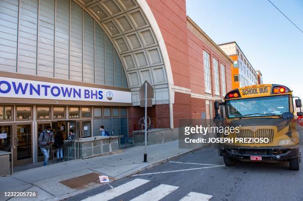 Students enter their new Downtown Burlington High School at a closed Macy's department store in Burlington, Vermont on March 30, 2021. - Vermont...