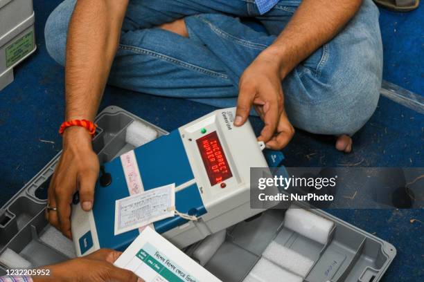 Polling officer checking the control unit of an Electronic Voting Machine at a safe house ahead of 4th phase of West Bengal Assembly elections in...