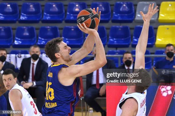 Barcelona's Spanish center Pau Gasol is challenged by FC Bayern Munich's German center Leon Radosevic during the Euroleague basketball match between...