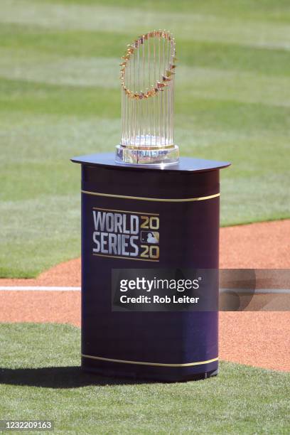 The World Series trophy is displayed on field during the Dodgers ring ceremony prior to the game between the Washington Nationals and the Los Angeles...