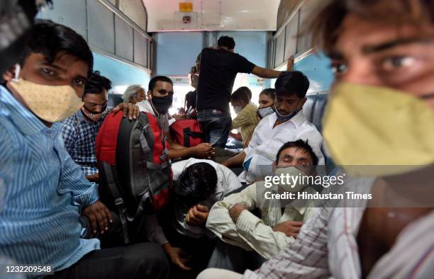 Migrants on board a train from Mumbai to Varanasi at Lokmanya Tilak Terminus on April 9, 2021 in Mumbai, India. Amid the surge in Covid-19 cases in...