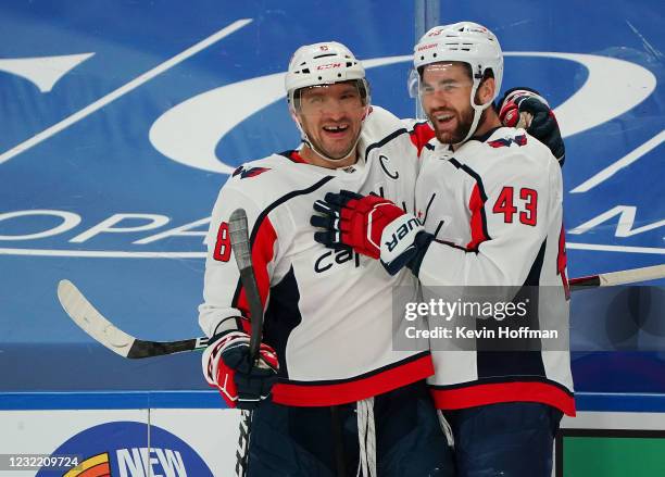 Alex Ovechkin of the Washington Capitals celebrates his goal against the Buffalo Sabres with Tom Wilson during the first period at KeyBank Center on...