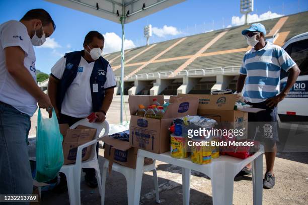 Health workers receive donations at a vaccination post in the Sambodromo on April 9, 2021 in Rio de Janeiro, Brazil. Health authorities have...