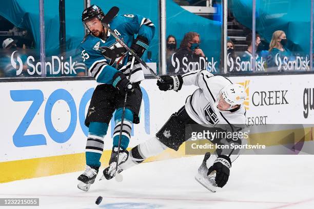 San Jose Sharks defenseman Erik Karlsson and Los Angeles Kings left wing Austin Wagner battle for the puck during the San Jose Sharks game versus the...