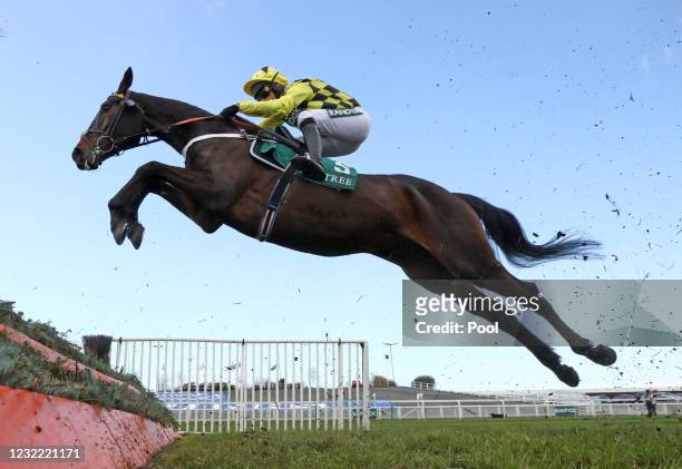 Shishkin ridden by Nico de Boinville jumps a fence before going on to win the Doom Bar Maghull Novices' Chase during Grand National Day of the 2021...