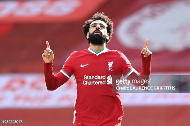 Liverpool's Egyptian midfielder Mohamed Salah celebrates after scoring his team's first goal during the English Premier League football match between...