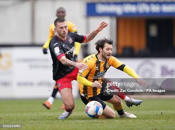Cambridge United's Wesley Hoolahan and Exeter City's Lewis Page battle for the ball during the Sky Bet League Two match at the Abbey Stadium,...