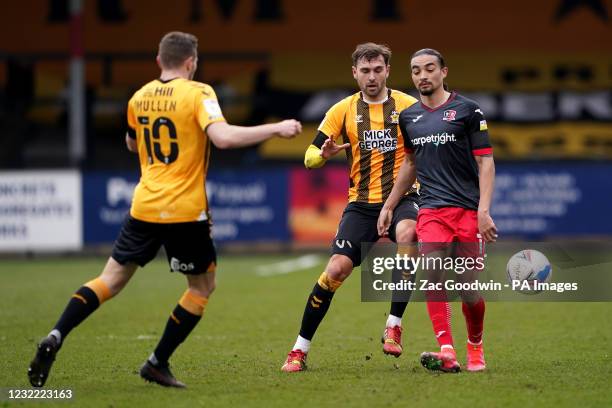 Cambridge United's Greg Taylor and Exeter City's Randell Williams battle for the ball during the Sky Bet League Two match at the Abbey Stadium,...