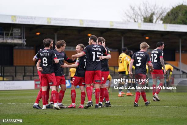 Exeter City's Matt Jay celebrates with teammates after scoring his sides fourth goal during the Sky Bet League Two match at the Abbey Stadium,...