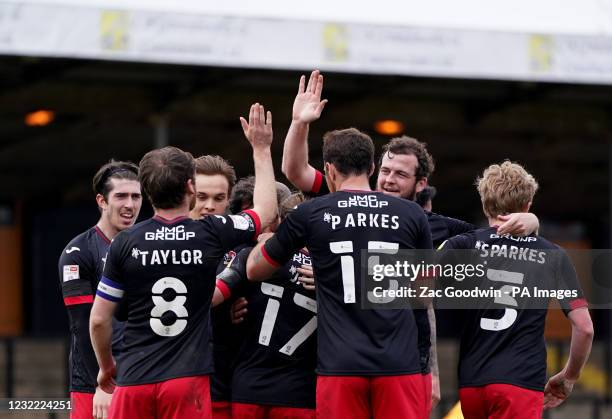 Exeter City's Matt Jay celebrates with teammates after scoring his sides fourth goal during the Sky Bet League Two match at the Abbey Stadium,...