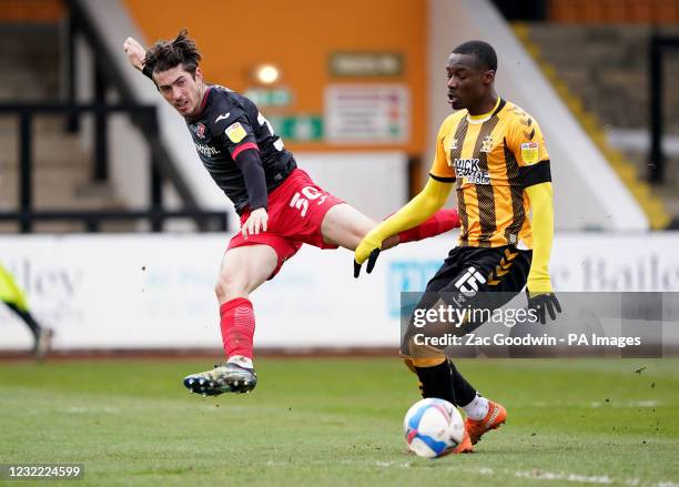 Cambridge United's Jubril Okedina and Exeter City's Joshua Key battle for the ball during the Sky Bet League Two match at the Abbey Stadium,...