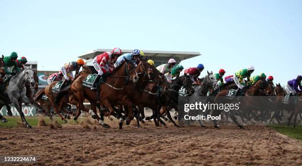 Runners and riders at the start of the Randox Grand National Handicap Chase during Grand National Day of the 2021 Randox Health Grand National...