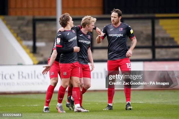 Exeter City's Archie Collins celebrates with teammates after scoring his sides third goal during the Sky Bet League Two match at the Abbey Stadium,...