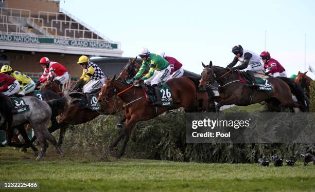 Runners and riders clear The Chair during the Randox Grand National Handicap Chase, on Grand National Day of the 2021 Randox Health Grand National...