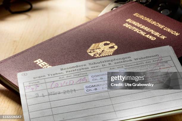 Bonn, Germany In this photo illustration a travel and vaccination passport with proof of Corona vaccination on April 05, 2021 in Bonn, Germany.