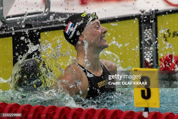 Kira Toussaint reacts upon competing in the 50 meter backstroke during the final in the Eindhoven Qualification Meet in Eindhoven on April 10, 2021....