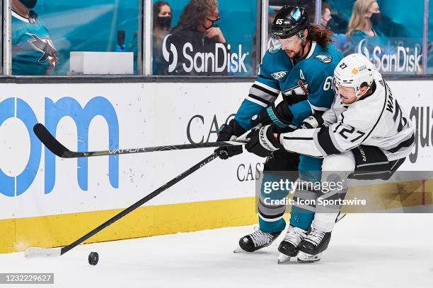 San Jose Sharks defenseman Erik Karlsson and Los Angeles Kings left wing Austin Wagner battle for the puck during the San Jose Sharks game versus the...