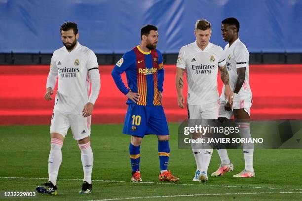 Barcelona's Argentinian forward Lionel Messi reacts after Real Madrid's German midfielder Toni Kroos scored during the "El Clasico" Spanish League...