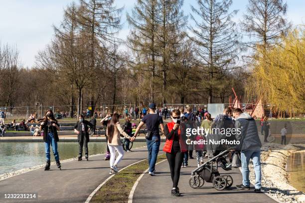 Families enjoy sunny, warm day after particularly cold period amid the third wave of Coronavirus pandemic in a public park in Krakow, Poland on April...