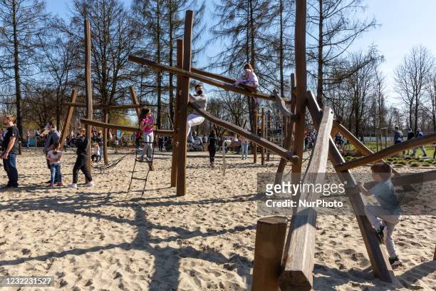 Families enjoy sunny, warm day after particularly cold period amid the third wave of Coronavirus pandemic in a public park in Krakow, Poland on April...