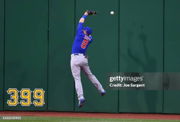 Ian Happ of the Chicago Cubs can't make a catch on a ball hit by Erik Gonzalez of the Pittsburgh Pirates during the second inning at PNC Park on...