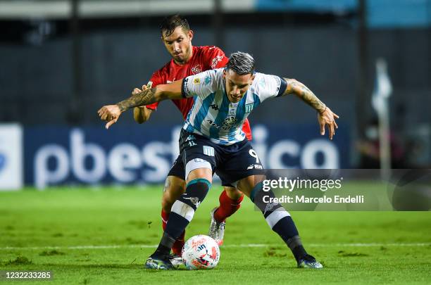 Enzo Copetti of Racing Club fights for the ball with Lucas Rodriguez of Independiente during a match between Racing Club and Independiente as part...