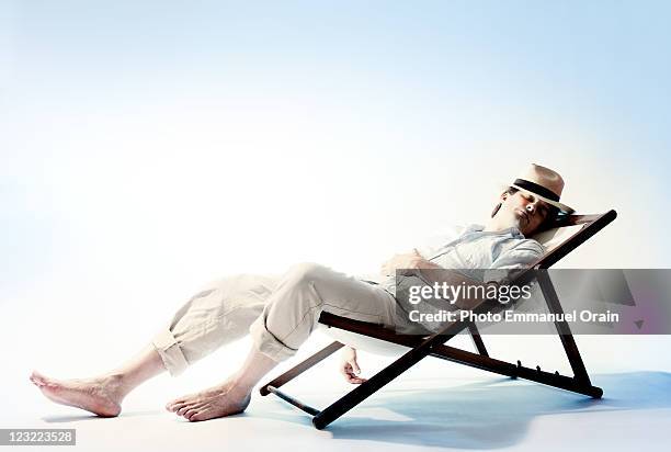 Resting In Chair Man Relaxing On Chair Arms Behind Head Side View Photos and Premium ...