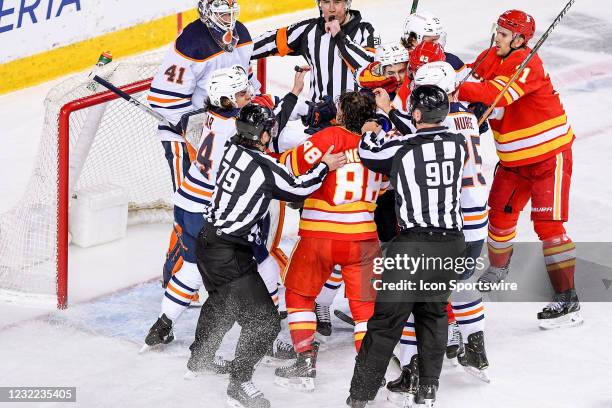 Calgary Flames Right Wing Andrew Mangiapane and Edmonton Oilers Defenceman William Lagesson rough one another after the whistle during the second...