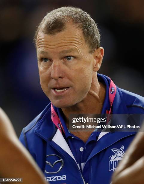 John Blakey, Assistant Coach of the Kangaroos addresses his players during the 2021 AFL Round 04 match between the North Melbourne Kangaroos and the...