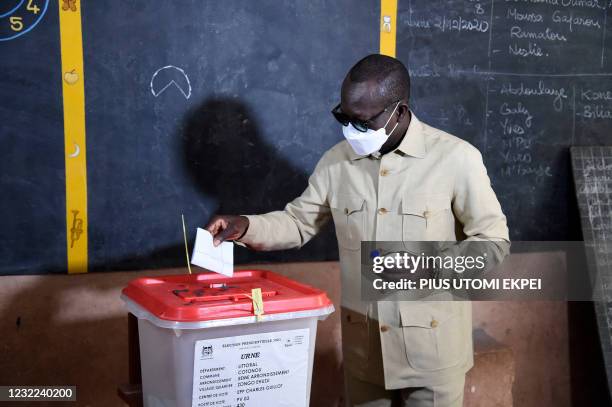 Incumbent Benin President Patrice Talon casts his ballot at the Zongo Ehuzu polling station to vote during the Benin Presidential election in Cotonou...