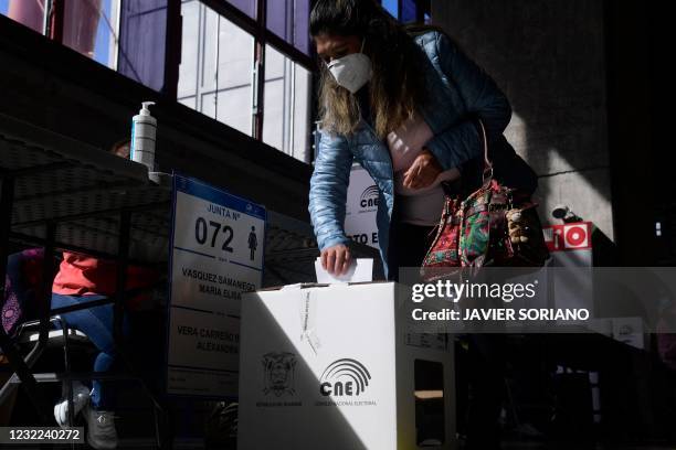 An Ecuadoran resident casts her vote for the second round of Presidential elections at a polling station at the Casa de Campo park in Madrid on April...