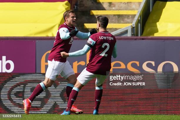 Burnley's Czech striker Matej Vydra celebrates with Burnley's English defender Matthew Lowton after scoring the first goal during the English Premier...