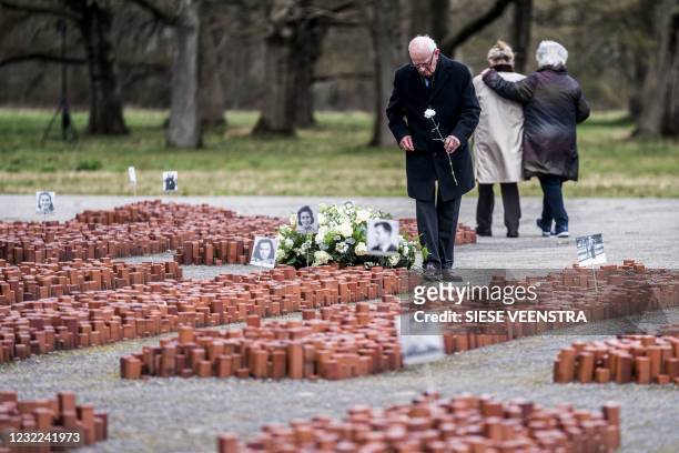 Fred Mouw lays flowers on the grounds of the memorial centre during the commemoration of 76 years since the liberation of the Westerbork nazi camp in...