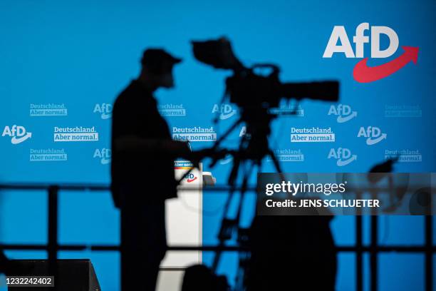 The AfD logo is seen as a cameraman works on the second day of congress of far-right Alternative for Germany party in Dresden, eastern Germany, on...