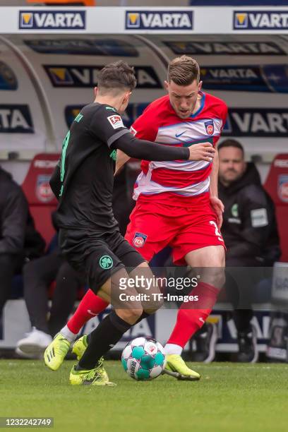 Marco Meyerhoefer of SpVgg Greuther Fuerth and Christian Kuehlwetter of 1.FC Heidenheim 1846 battle for the ball during the Second Bundesliga match...