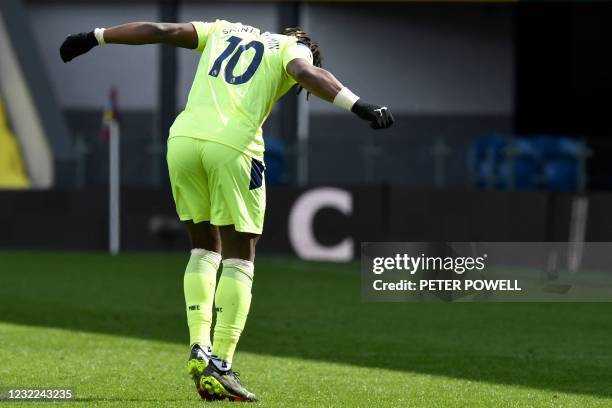 Newcastle United's French midfielder Allan Saint-Maximin dances as he celebrates scoring his team's second goal during the English Premier League...