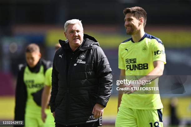 Newcastle United's English head coach Steve Bruce reacts after Newcastle United's Argentinian defender Federico Fernandez after winning the the...